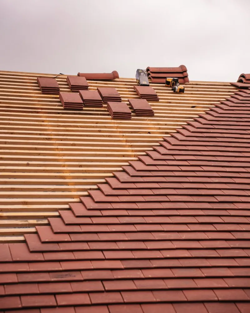 A roofer working on a roof